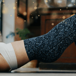 Hollie exercising on a yoga mat whilst eyes closed
